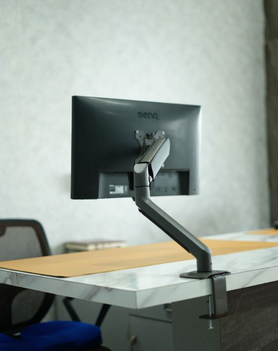 Indalio single Gas Spring Monitor Arm on a desk